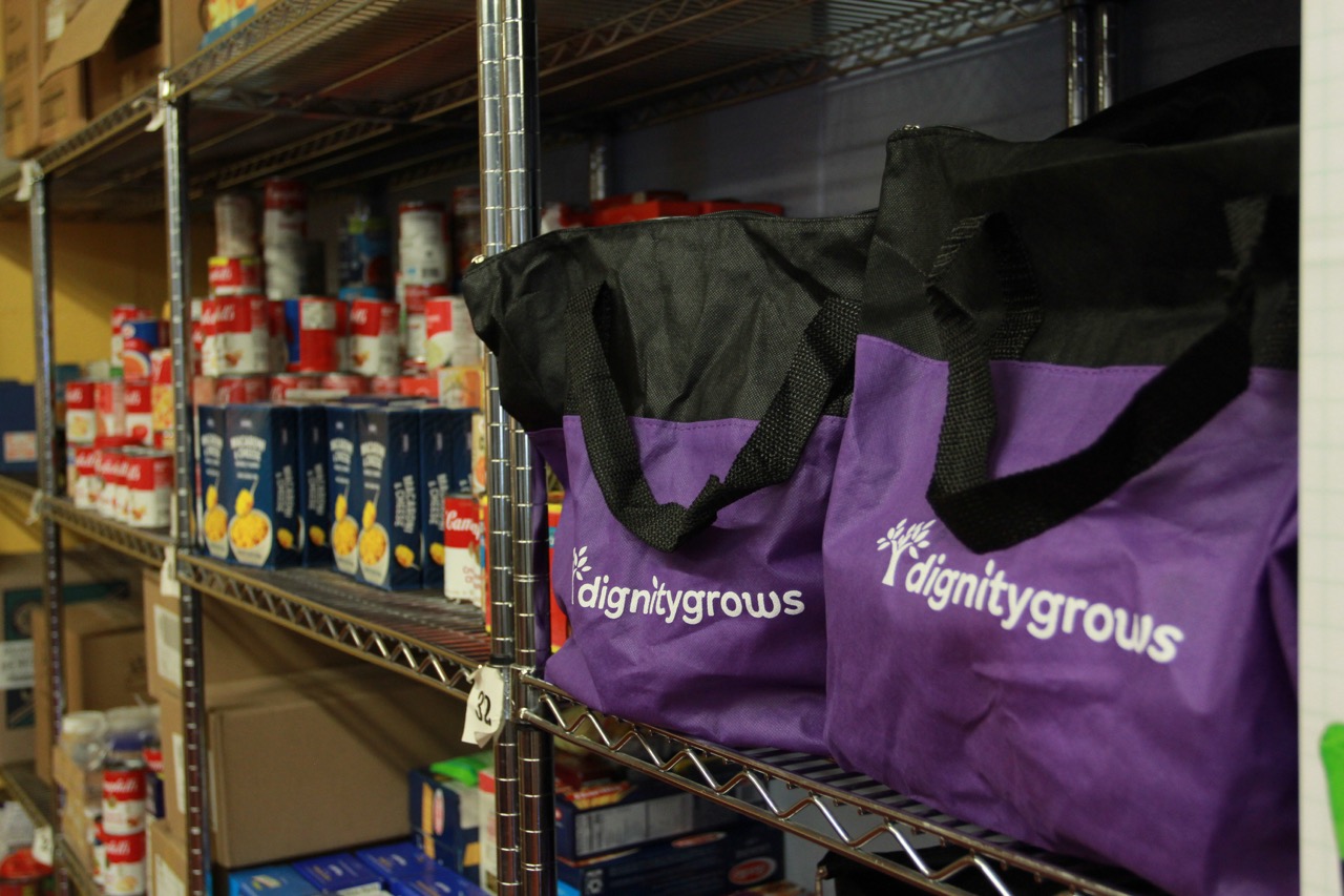 Dignity Grows Hartford volunteer assembled Hope In A Bag hygiene tote with products for those in need of hygiene items.